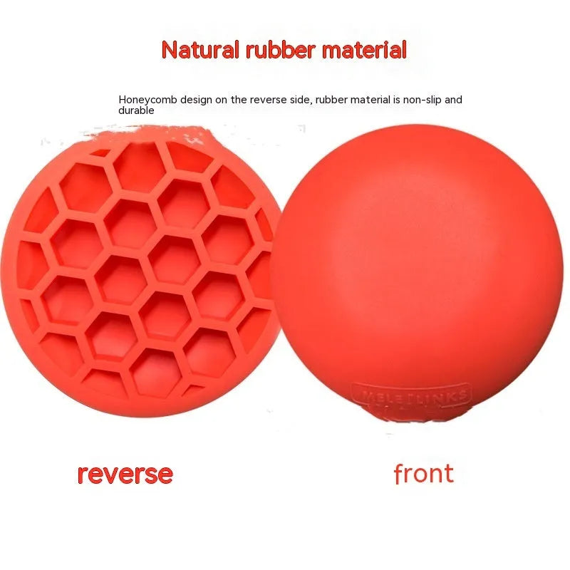 Orange-red golf training mat with weighted centre for swing practice