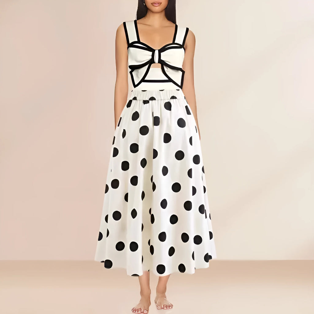Women's black one-piece swimsuit with attached beach dress featuring a round skirt and bow detail.