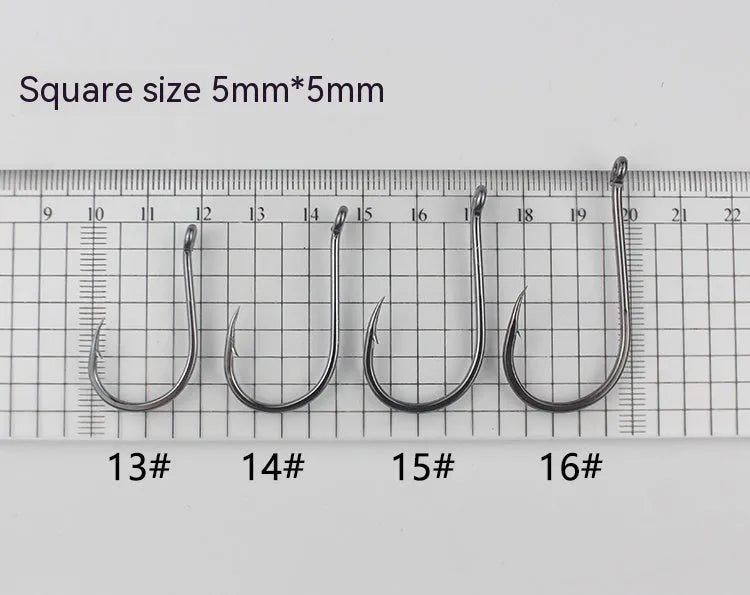 Bulk pack of alloy carbon steel barbed fishing hooks with crooked mouth and hole ring for rock and sea fishing.