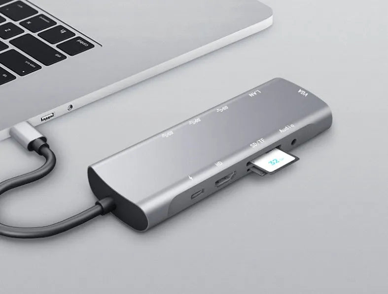 Grey aluminium USB-C docking station with HDMI, VGA, USB 3.0 ports and a 140mm cable.