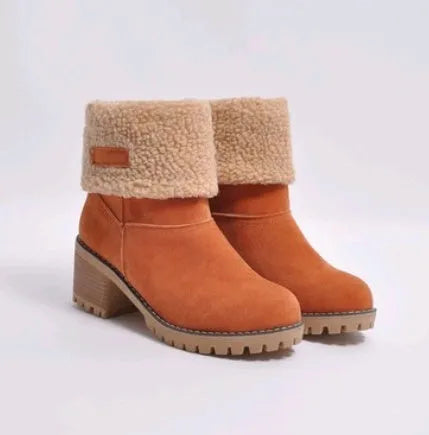 Women's black suede mid-tube knight snow boots with a thick sole and low flat heel on a plain background.