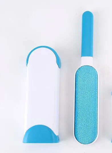 Blue reusable pet hair removal brush with self-cleaning base for sofas and upholstery.