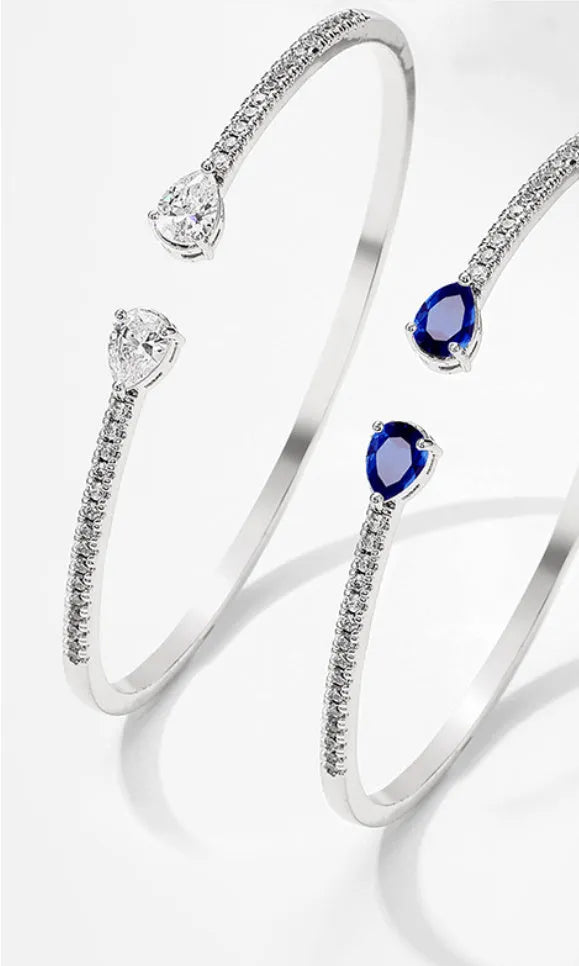 Copper personalised bracelet with multi-zircon inlaid design in simple style, shown in blue and white colour options.