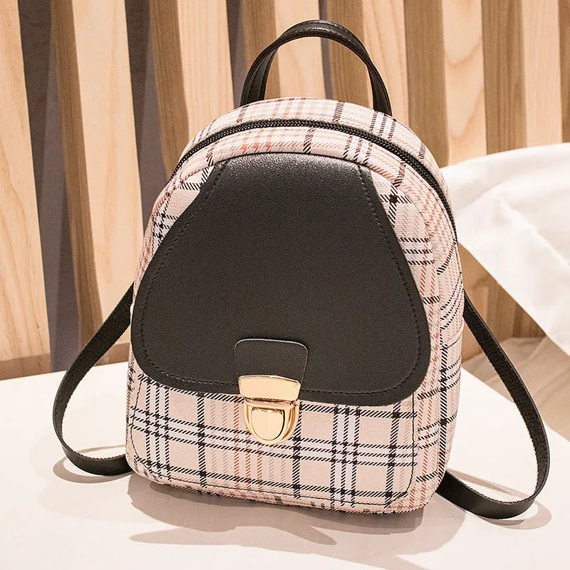 Diagonal shoulder phone bag in PU material showing adjustable strap and handheld carry option