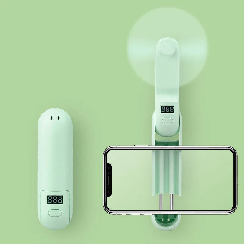 Green folding handheld mini fan with USB charging cable