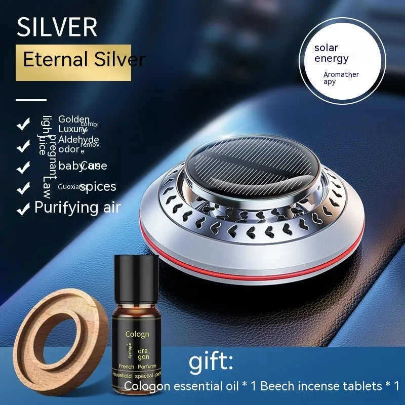 Solar-powered aluminium alloy car air freshener diffuser in black colour on a car dashboard.