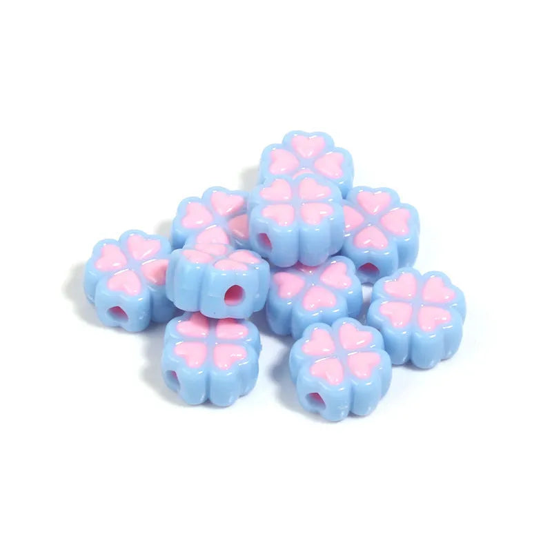 Acrylic four-leaf clover beads with frosted finish in mixed cartoon colours