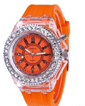 Women's LED luminous quartz watch with round 43mm alloy case and colourful silicone strap options.