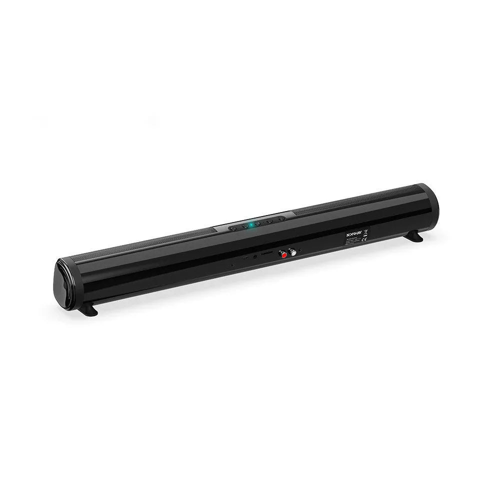 Tall black Bluetooth sound bar speaker with remote control on a wooden surface