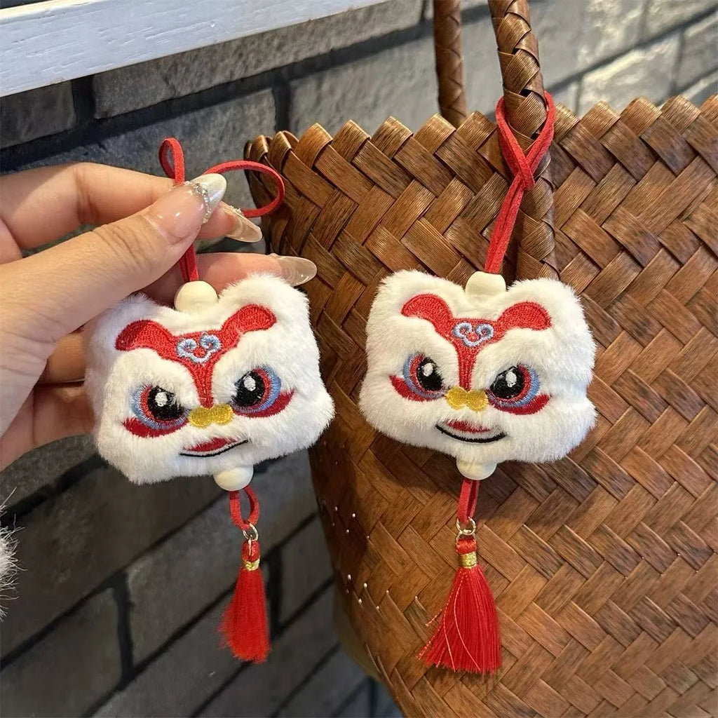 Chinese style plush lion tassel keychain ornament with star stone detail in blue or yellow