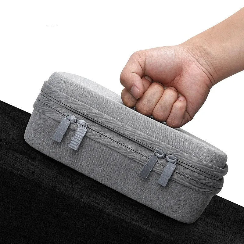 Black EVA digital storage bag with headset storage compartments open showing organisation for cables and accessories