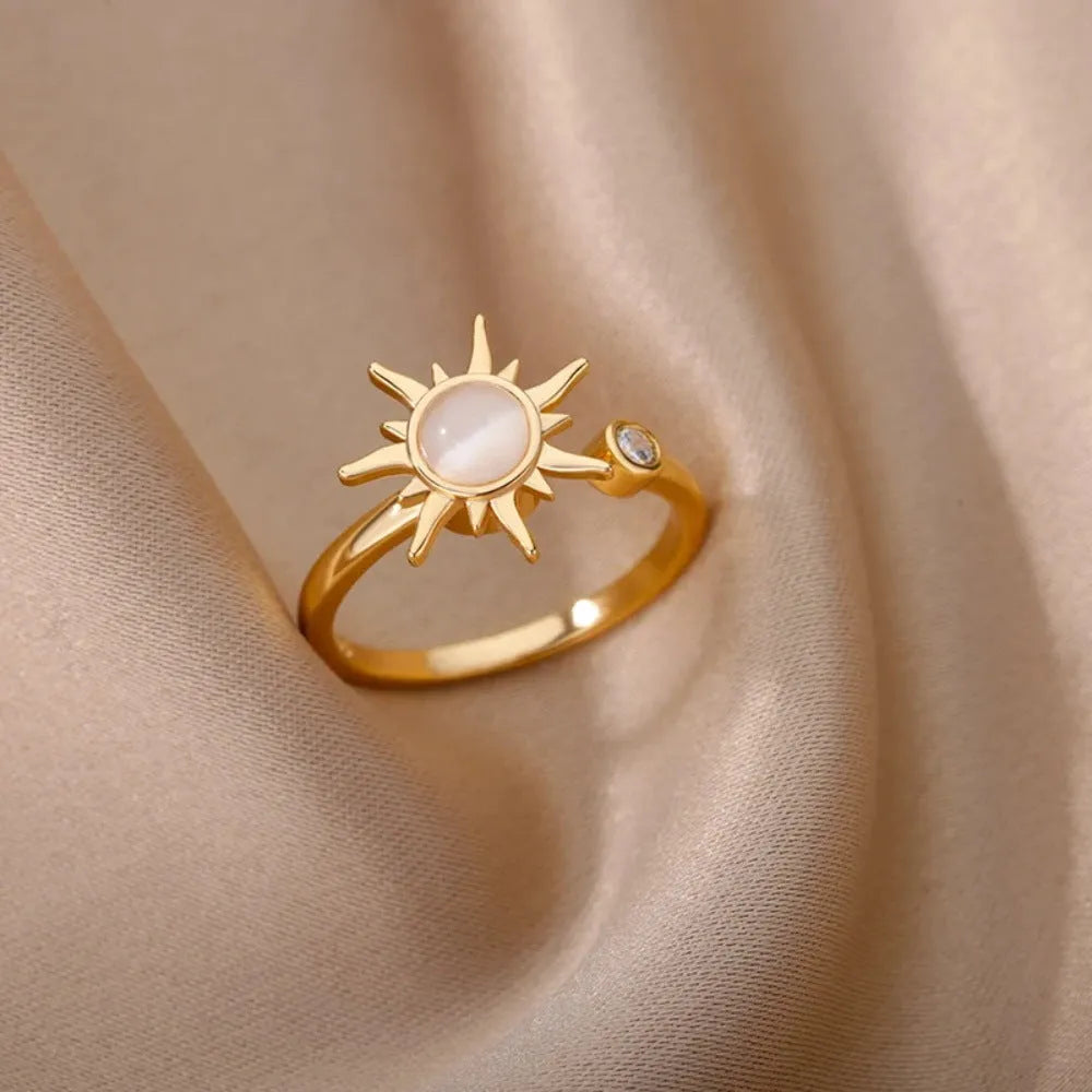 Adjustable copper ring with rotatable element in gold or platinum finish, simple geometric design