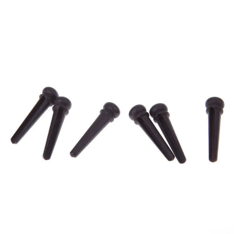Six matt black ebony guitar string nails with 5.3mm bayonet diameter for folk acoustic guitars