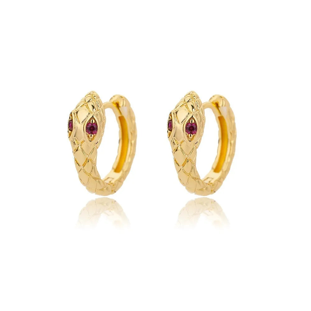 Geometric butterfly-shaped earrings with heart, bow, and star details in copper with a diamond-cut finish.