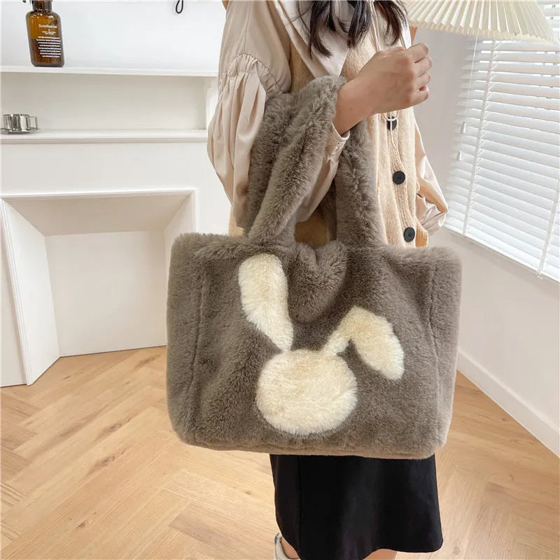 Plush shoulder bag with cartoon rabbit ears detail in solid colour