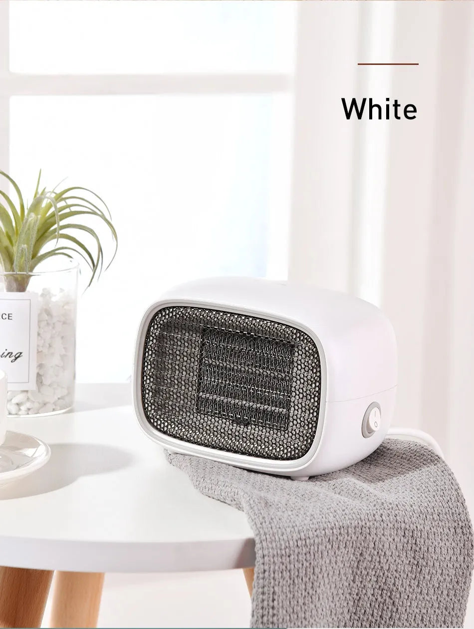 Compact green ceramic PTC heater with metal mesh front measuring 158mm long