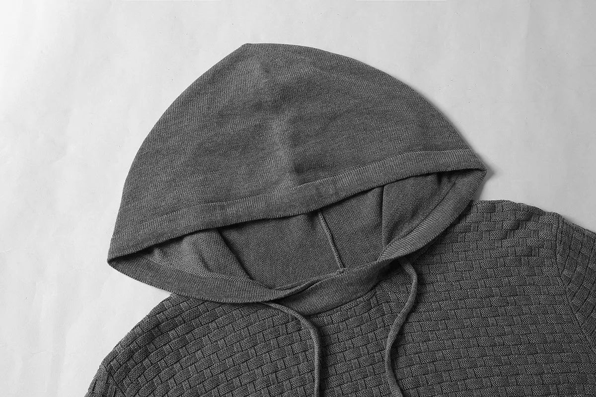 Men's black cotton-polyester blend hooded sweatshirt on a hanger.
