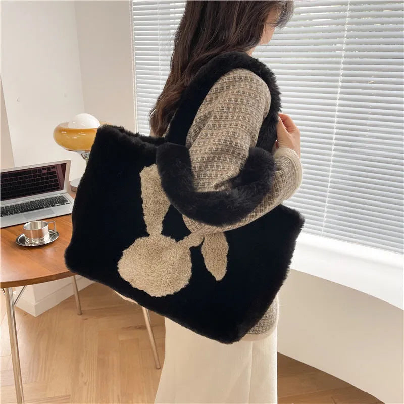Plush shoulder bag with cartoon rabbit ears detail in solid colour