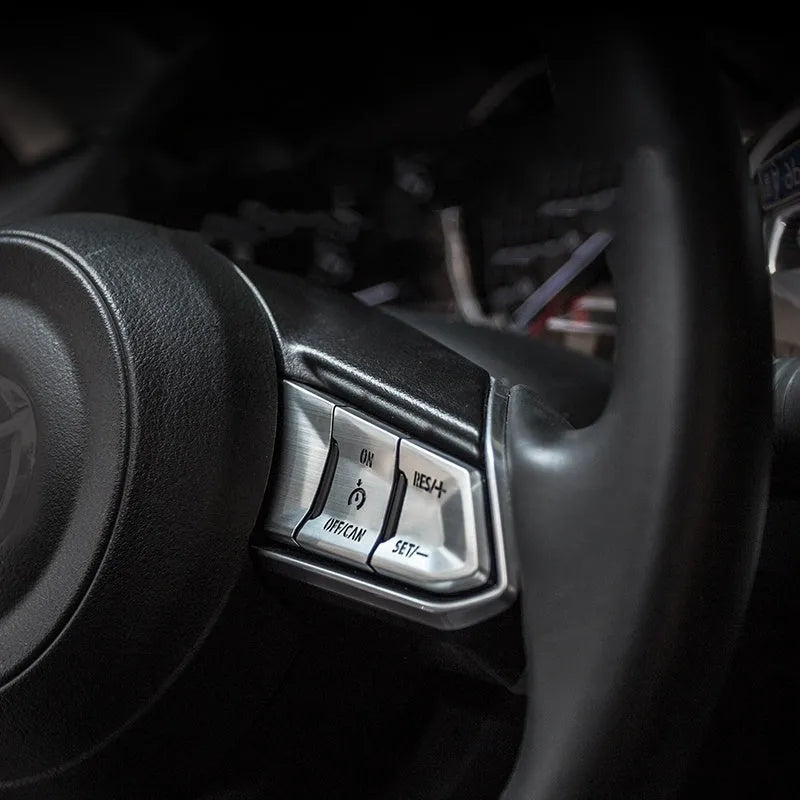 Atz modified vehicle steering wheel decorative sticker set showing aluminum alloy hollow button styles in brushed red, silver, and blue finishes