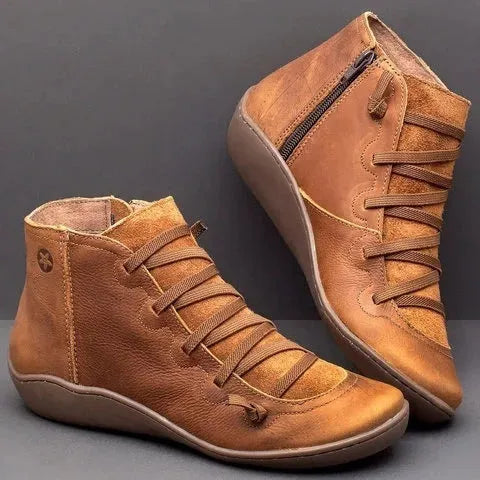 Women's flat wedge heel ankle booties in various colours including leopard print, with round toe and rubber sole.