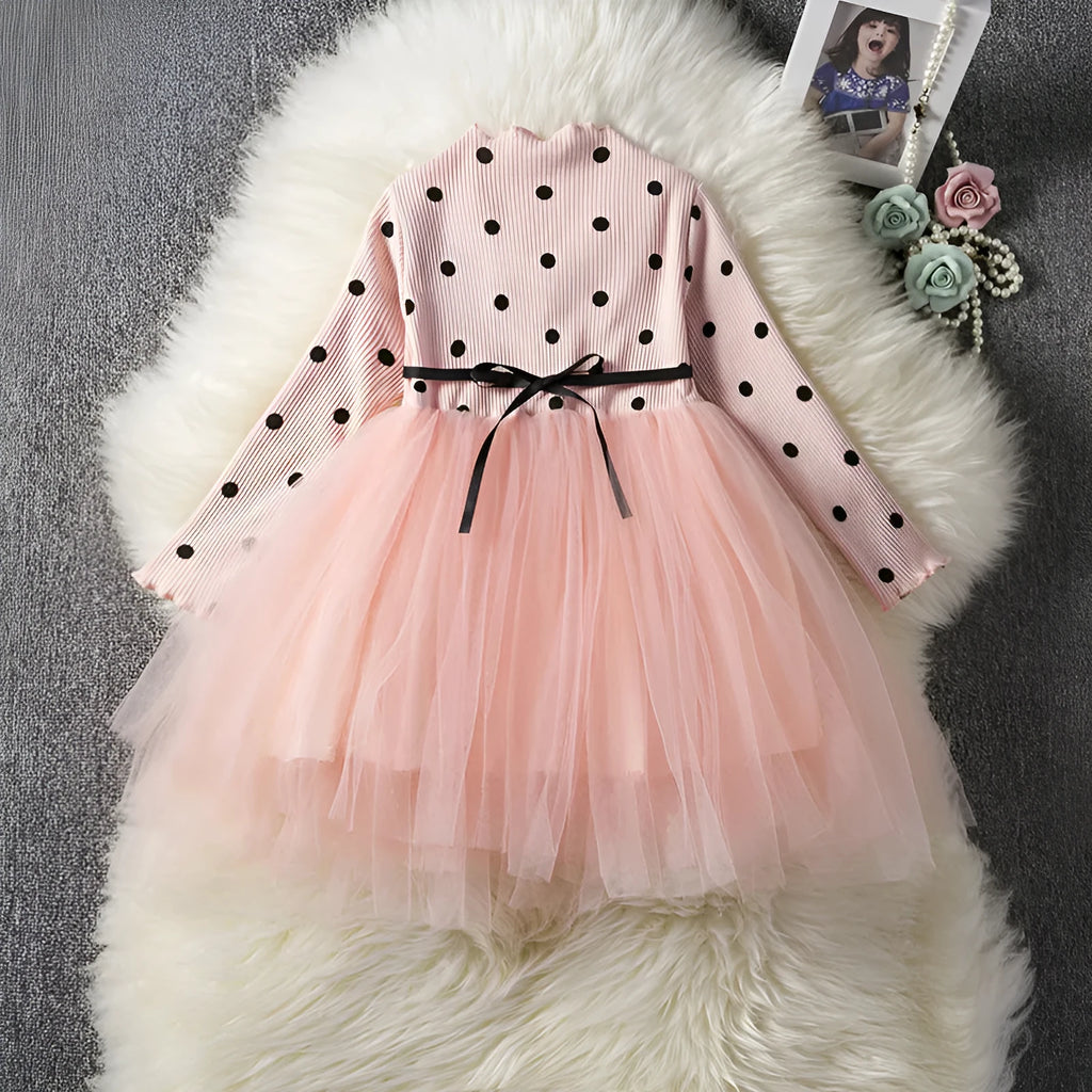 Baby girl wearing black lace tutu dress with long sleeves for birthday party