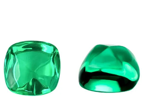 Loose cultivated emerald gemstone in Columbia green colour showing round and fancy cut shapes on a white background.