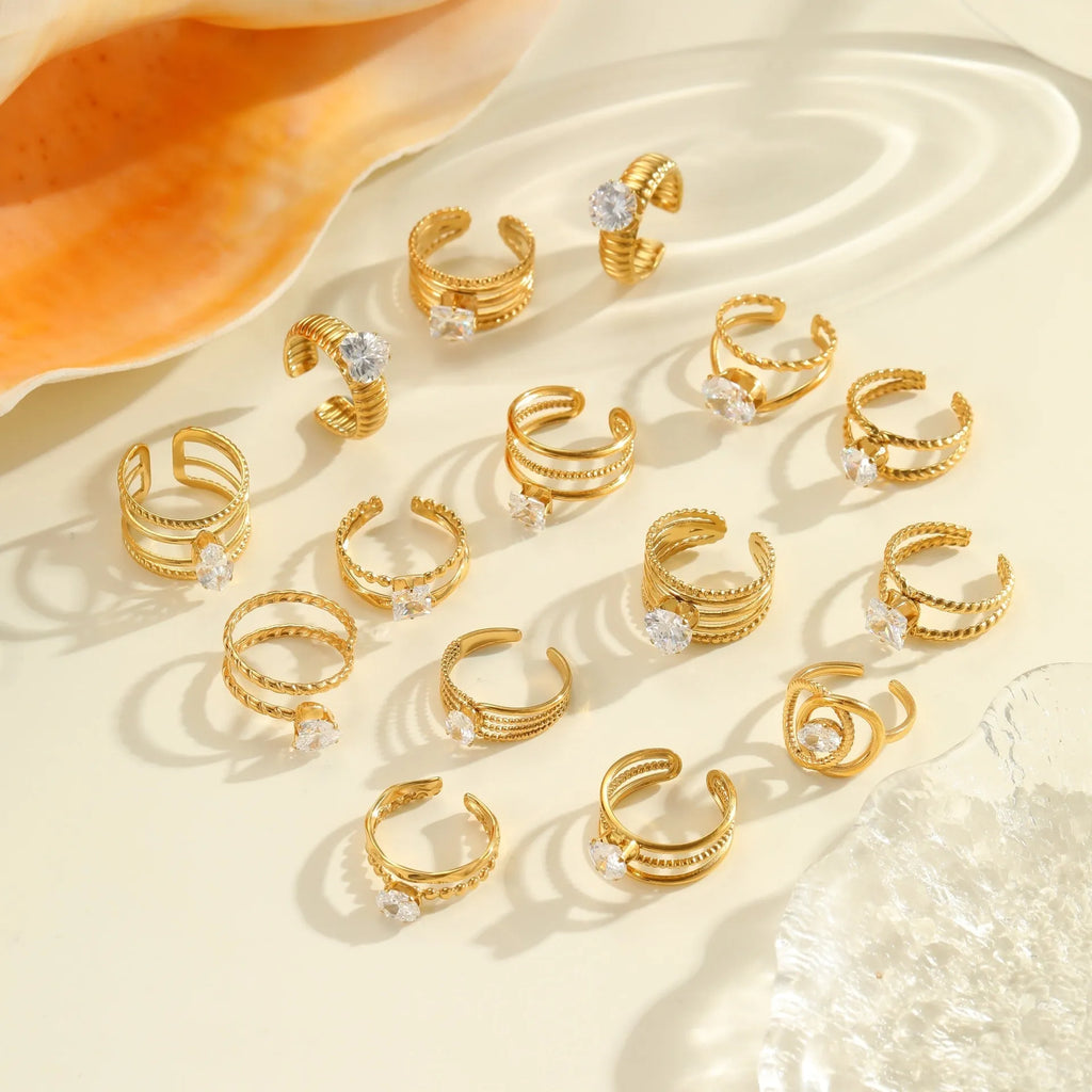 Women's geometric stainless steel ring with gold plating and inlaid zircon stones, shown in an open mouth free size design.