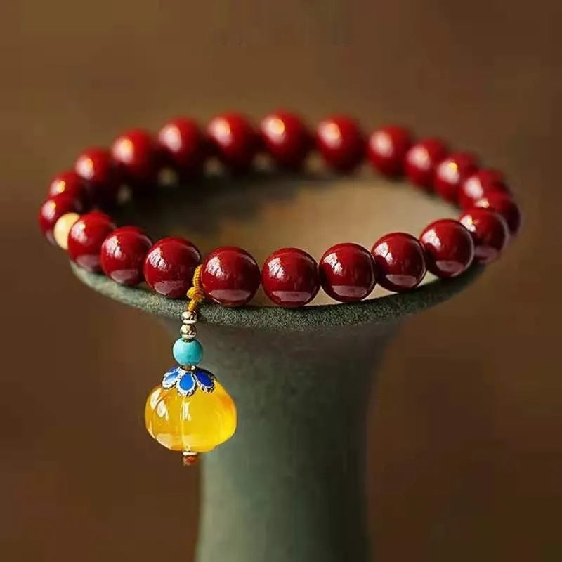 Handmade wave-shaped bracelet with alternating cinnabar and copper beads.