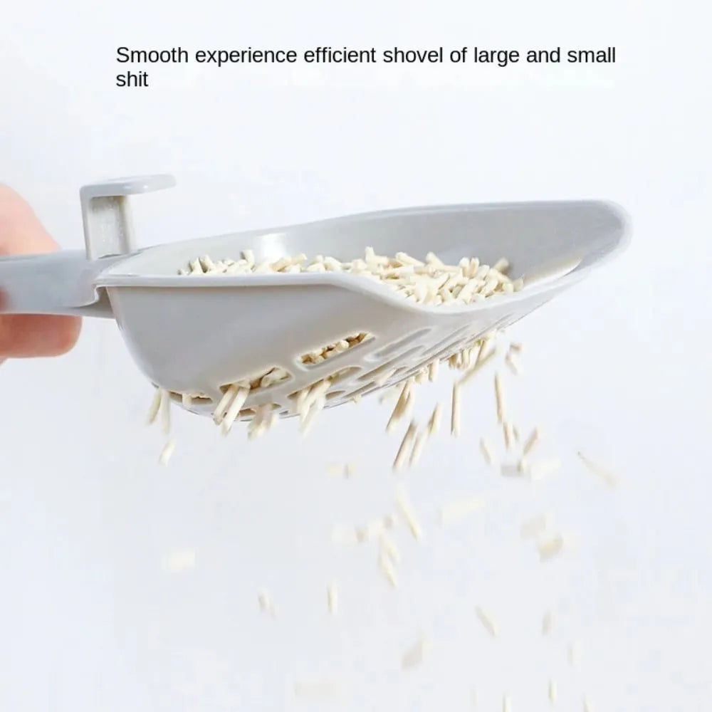 Grey plastic cat litter scoop with storage base showing perforated strainer design