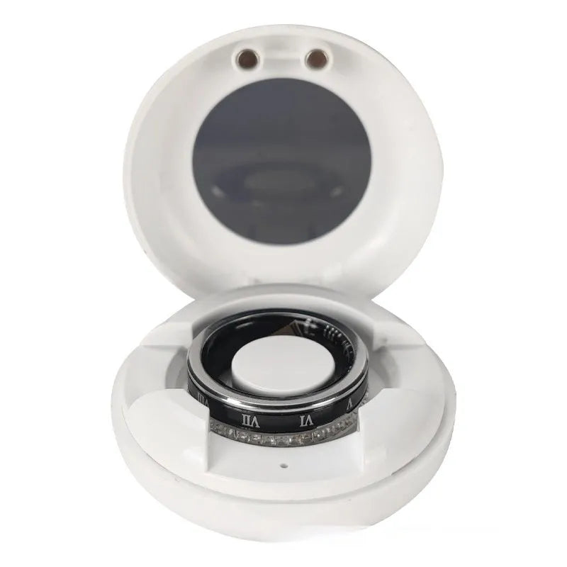 Gold and silver smart rings with diamond inlays displaying blood oxygen monitoring technology on a finger.