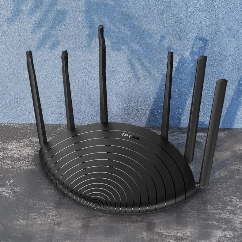 TL-WDR7661 black wireless router with multiple antennas on a desk
