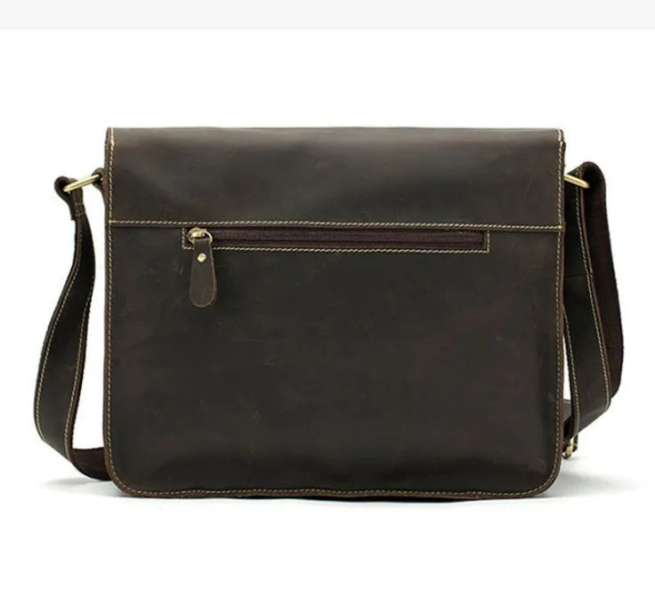 Brown leather vintage messenger bag with flap closure, antique buckle, and adjustable crossbody strap.