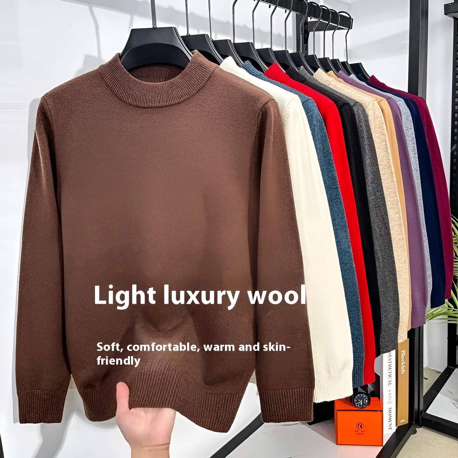 Man wearing a solid colour half turtleneck long sleeve jumper in a casual setting.