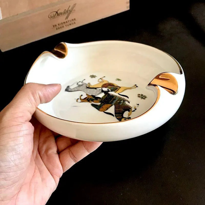 Bone ceramic cigar ashtray 175mm with hand-painted gold rim and horse motif on white background