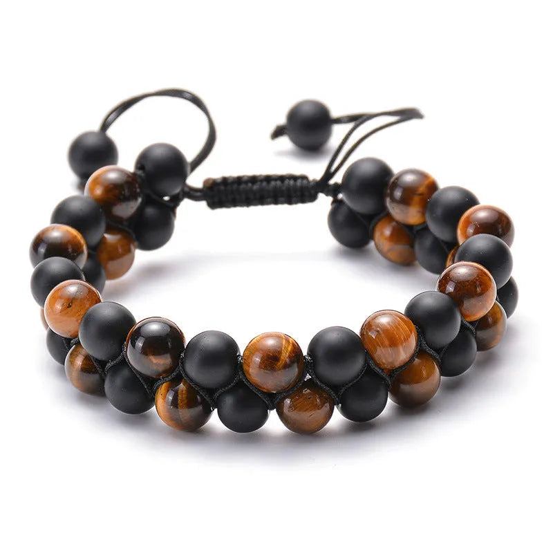 A pair of matte black agate bead bracelets with geometric design for him and her.