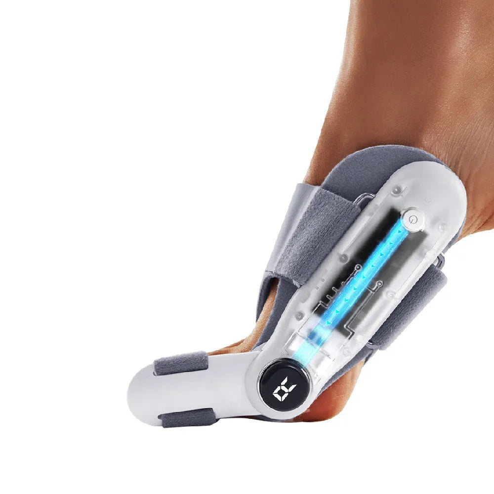 White plastic electric hallux valgus toe separator with soft silicone padding and a Type-C charging port.