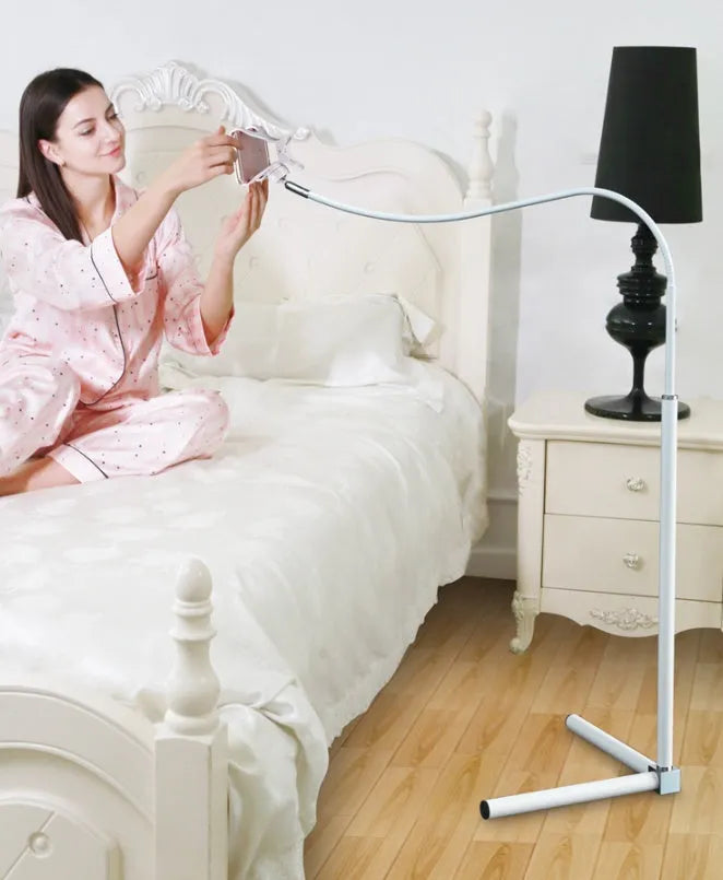 Black and white universal mobile phone holder shown as a bedside bracket and an under-bed floor stand.