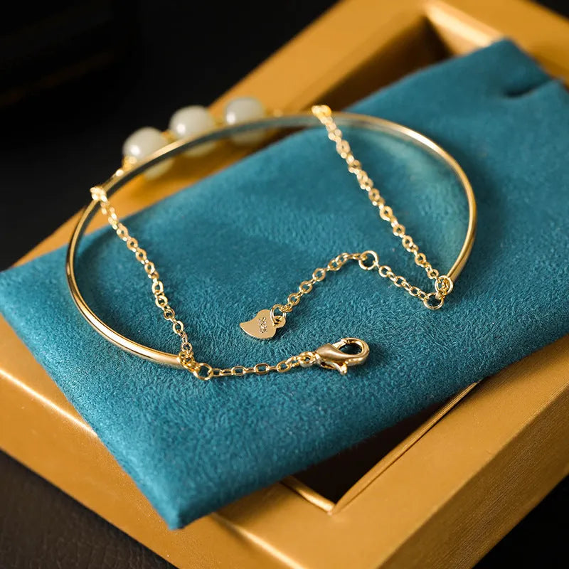 Women's Hetian jade bead bracelet with gold inlay detailing in single, double and three bead versions