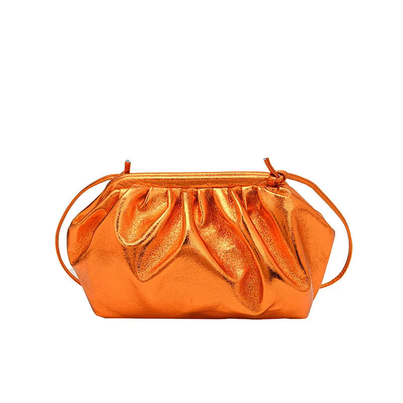 Simple hair clip fastening crossbody bag in shell shape, shown in rose red colour.