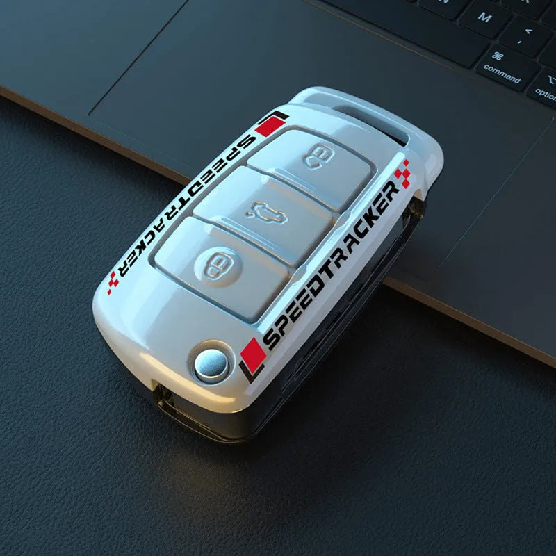 Carbon fibre style car key cover with mirror in feilin material, shown in carbon colour.