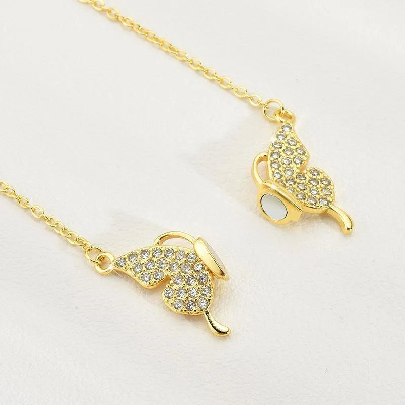Gold magnetic snap butterfly necklace with twisted titanium steel chain at clavicle length