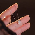 Double love geometric copper pendant necklace on clavicle chain, white gold finish