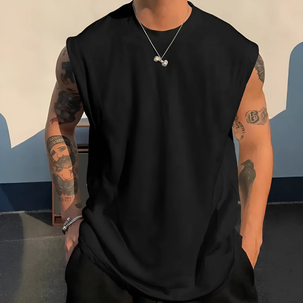 Men's solid colour loose fit cotton tank top on a hanger, showing straight hem and sleeveless design.