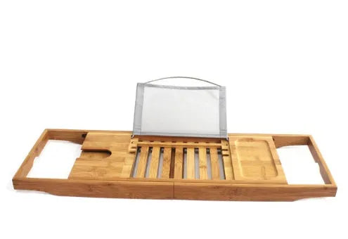 Bamboo desktop storage shelf for bathroom organisation next to bathtub