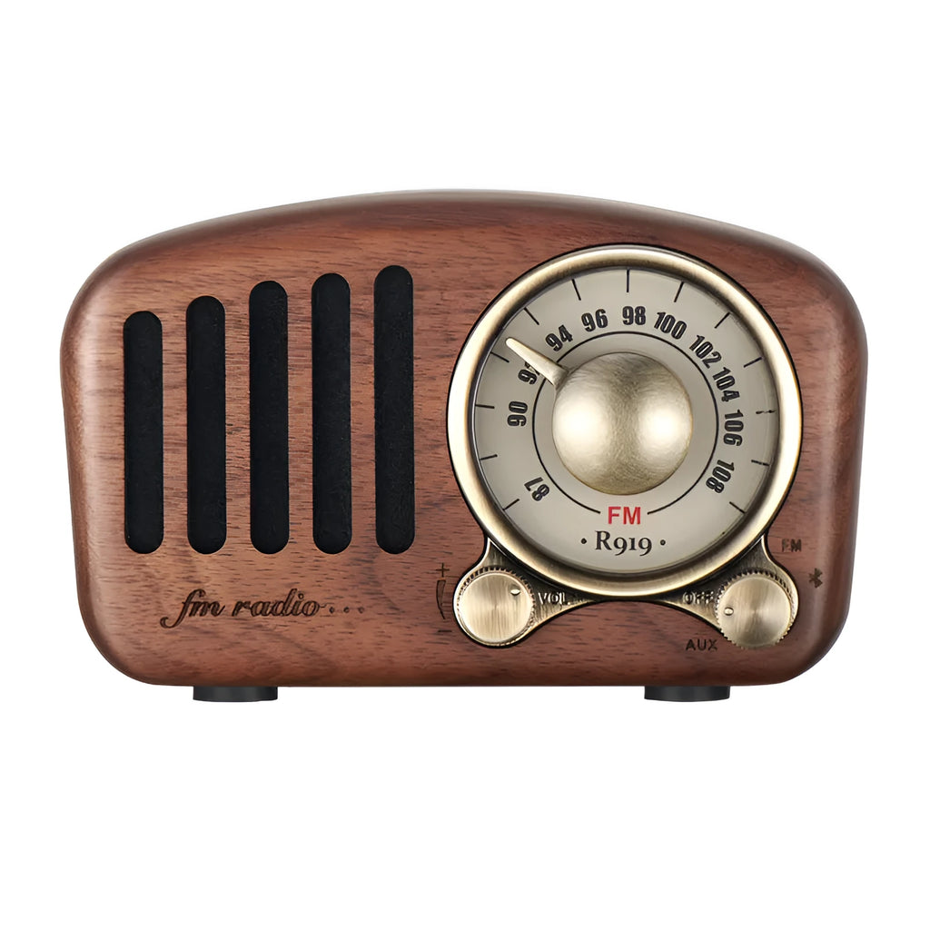 Compact retro wooden wireless Bluetooth speaker in cherry wood finish on a wooden table