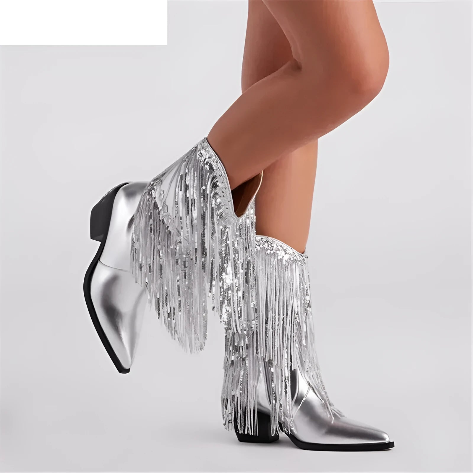 Women's black chunky heel tassel boots with pointed toe and super high stiletto heel on a plain background.