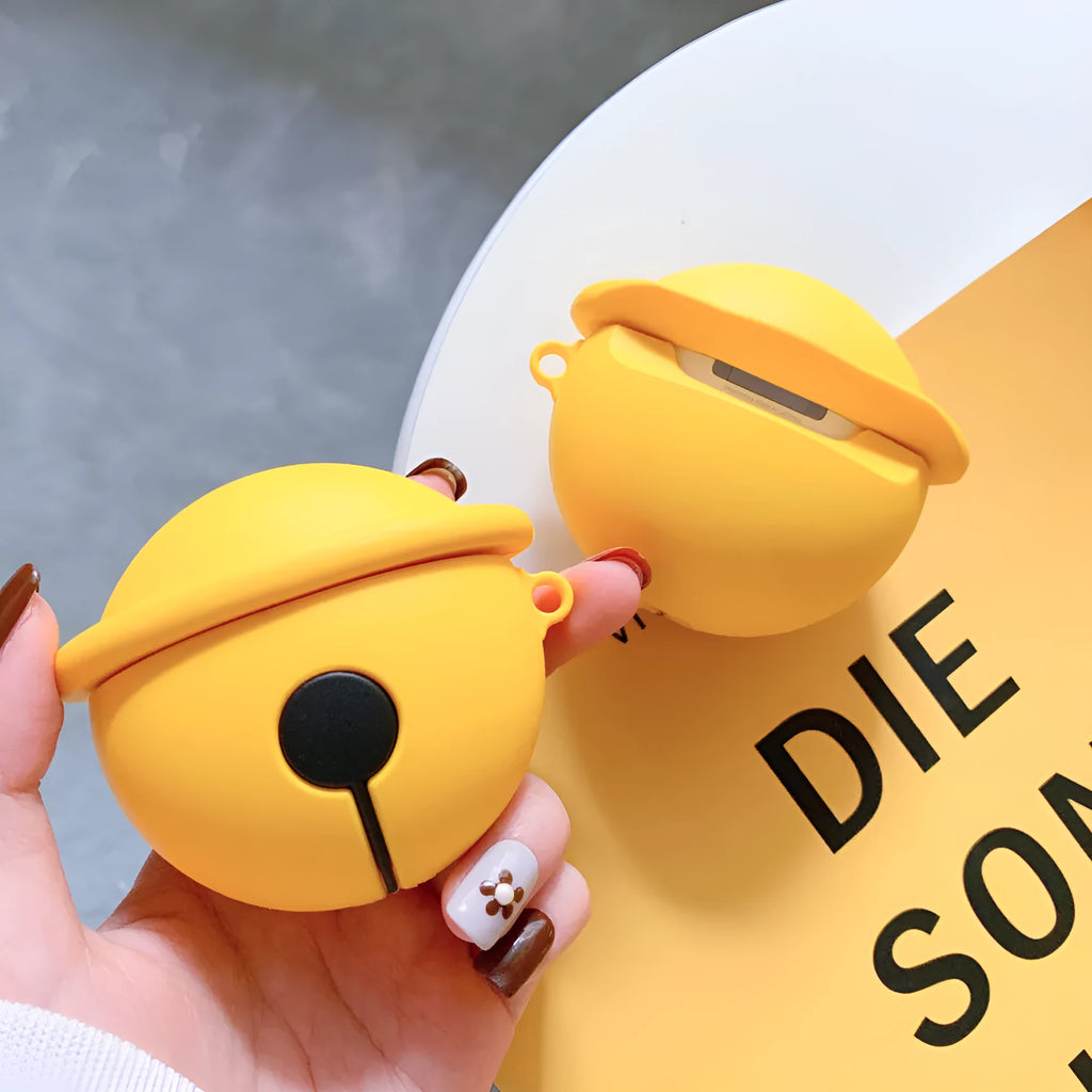 Yellow silicone AirPods case with small bell accessory attached for AirPods 1 and 2