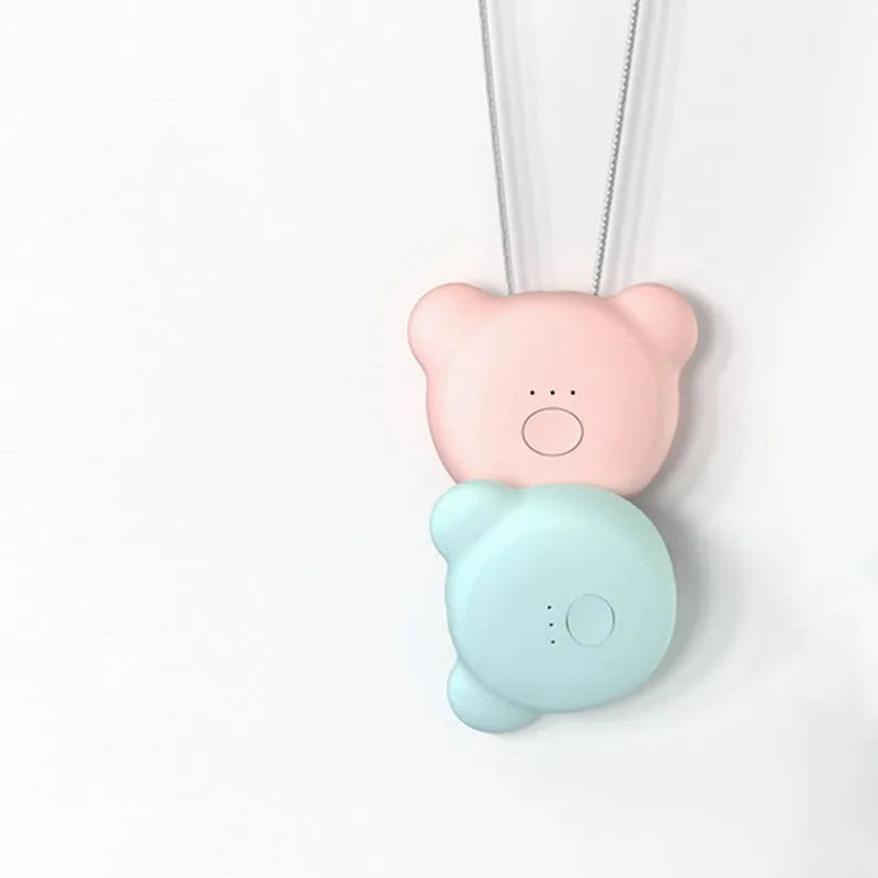 Mini USB air purifier necklace in pink showing compact wearable design with one-button control