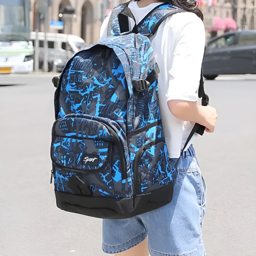Blue large nylon backpack with adjustable straps on a plain background.