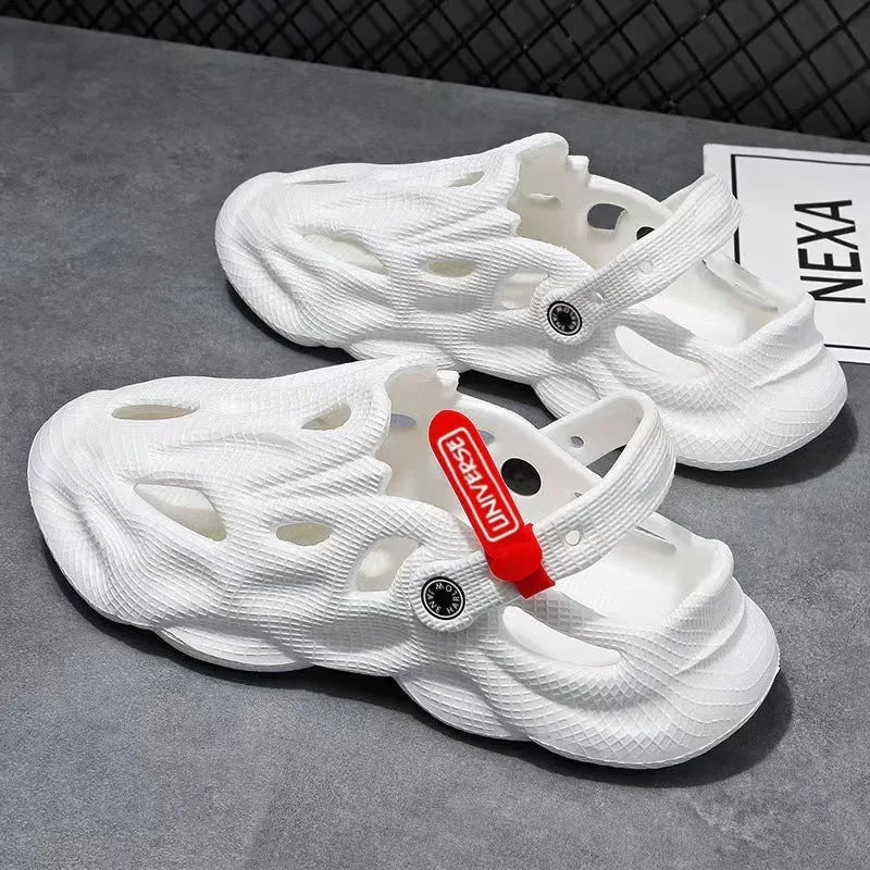Men's grey coconut slippers with closed toe design and EVA construction on wooden deck
